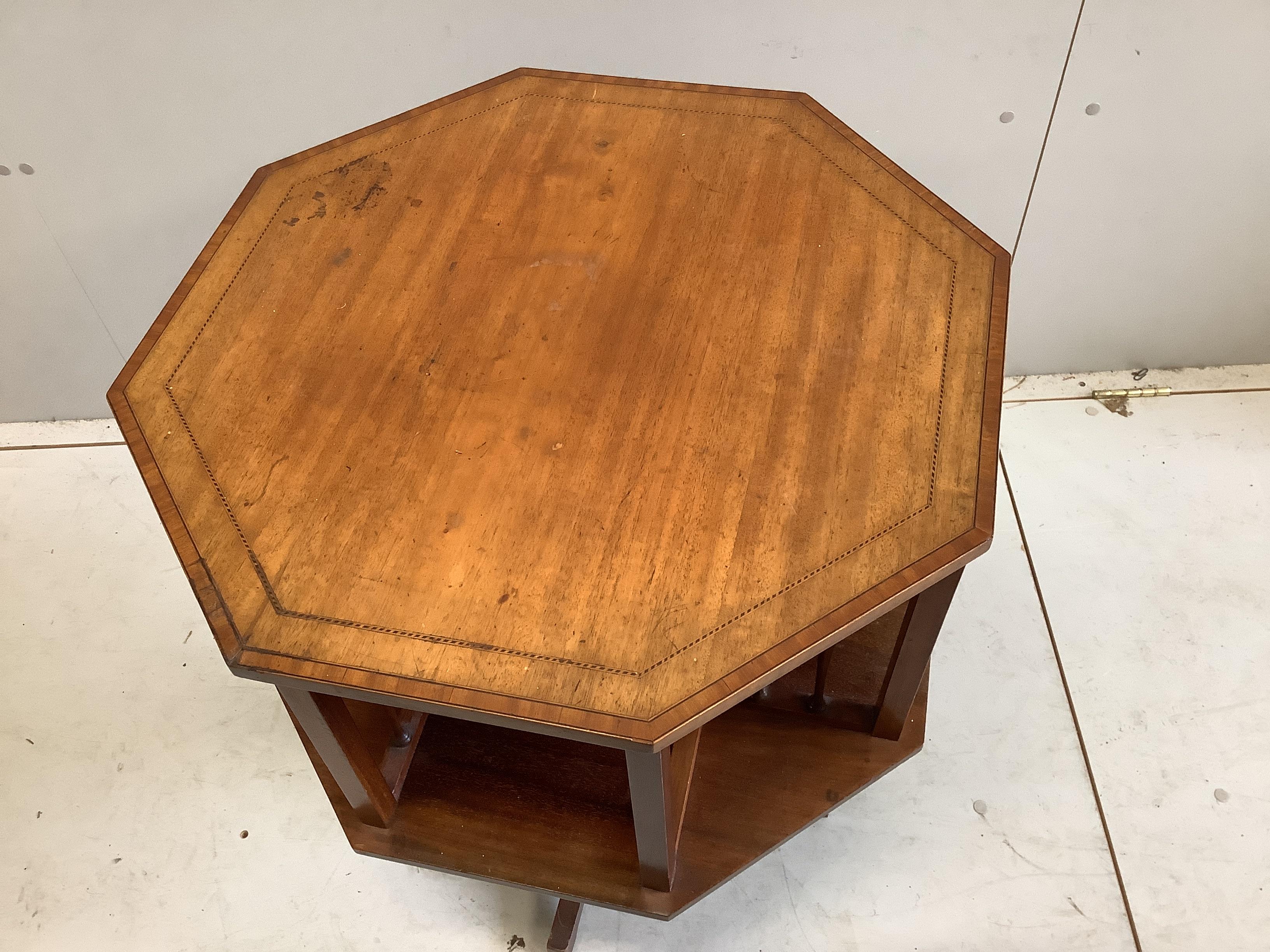 An Edwardian satinwood banded octagonal mahogany revolving bookcase, width 59cm, height 71cm